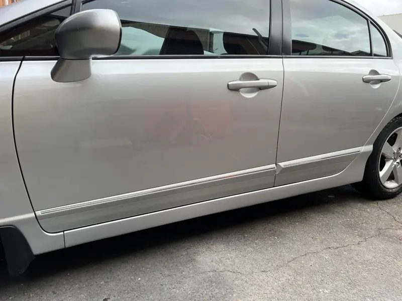 Silver Honda Civic side panels after repair