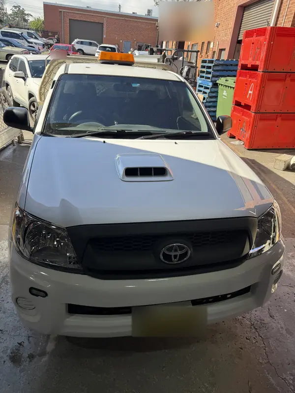 Toyota Hilux bonnet, grille and bumper after repair, seen from above