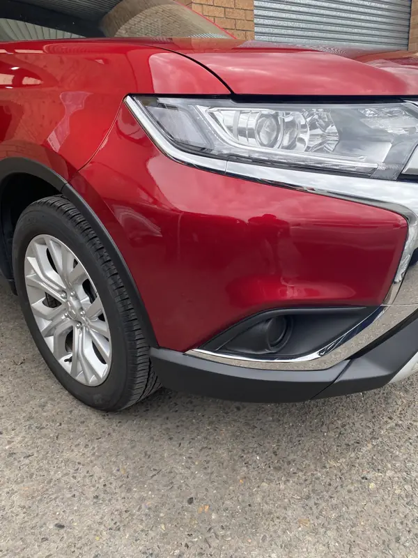 Outlander front bumper repaired and painted to match