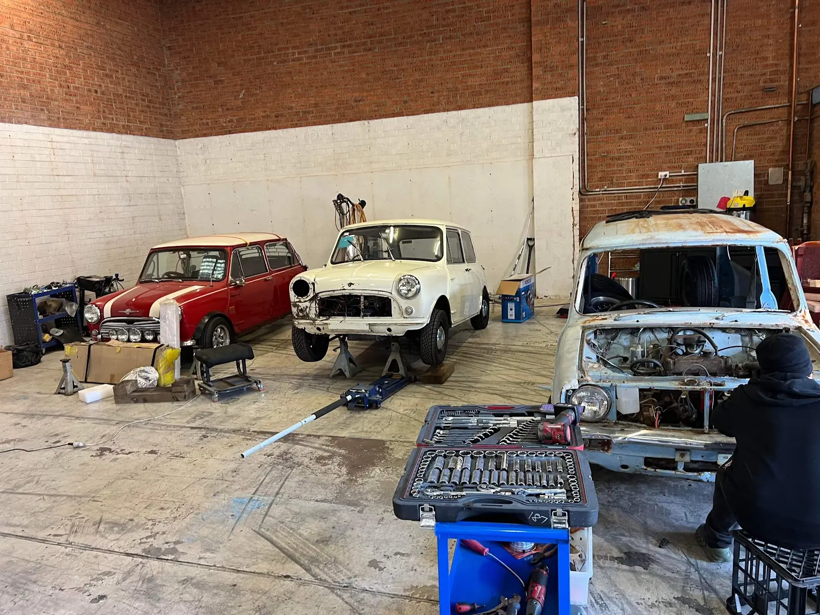 Inside the FilAus Prestige workshop with classic cars under restoration